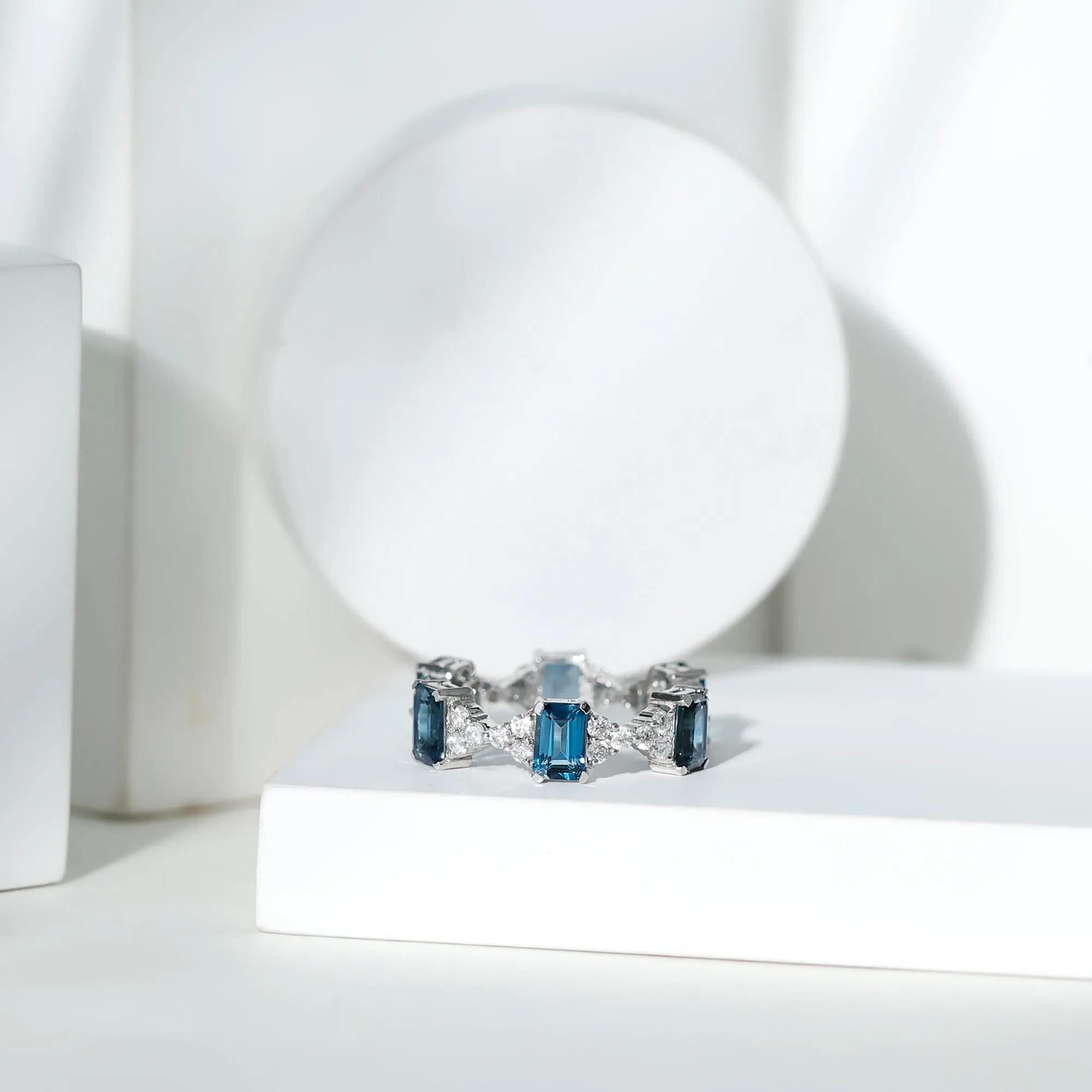 London Blue Topaz and Moissanite Eternity Ring